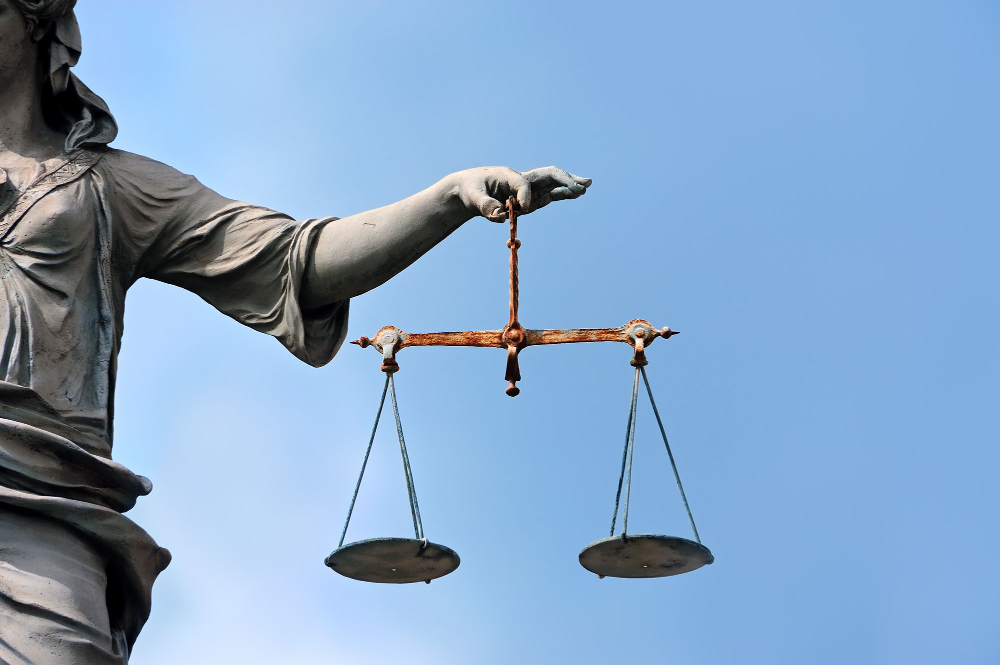 PHOTO: The scales of justice are held by a statue in an undated stock image.