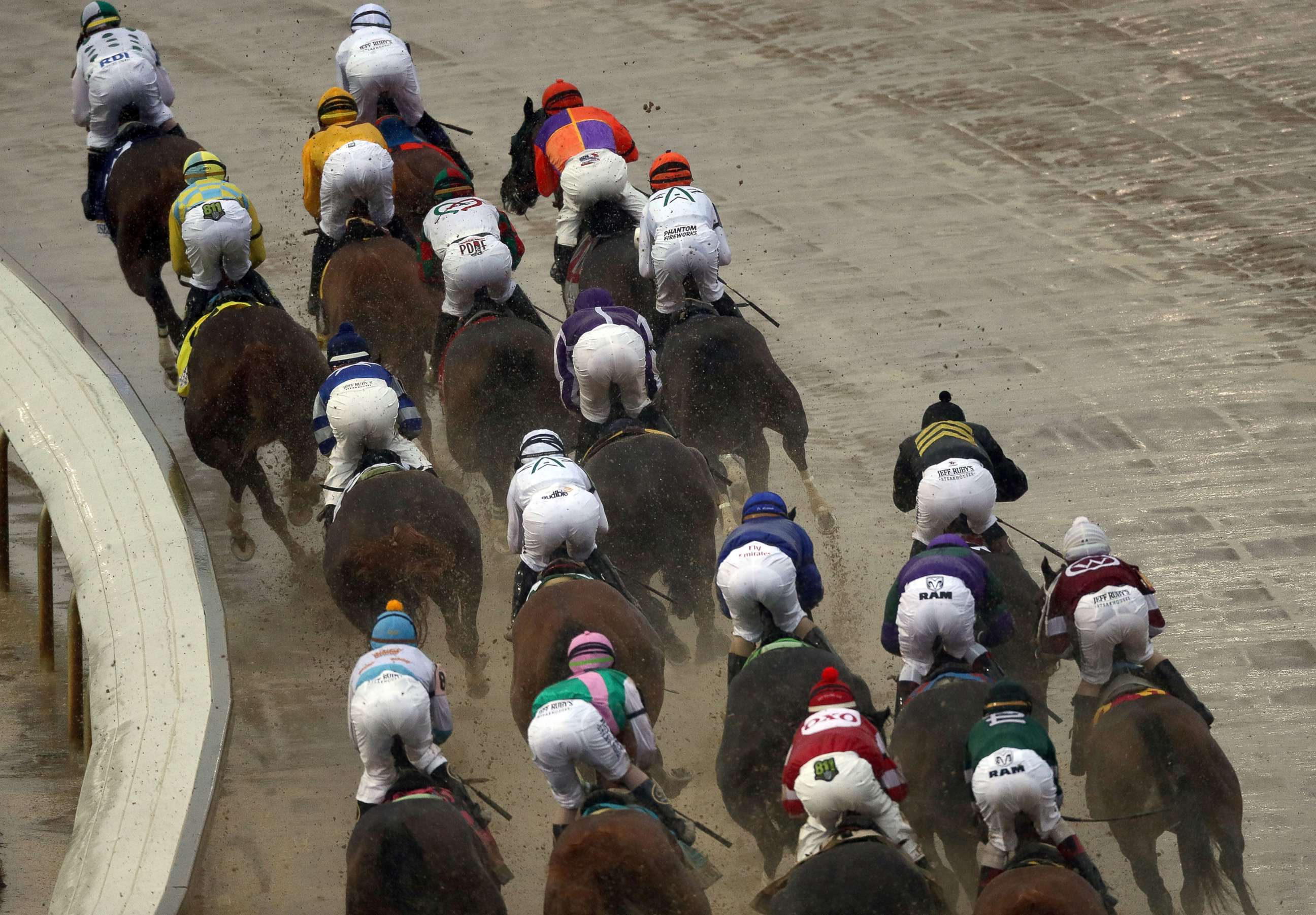 PHOTO: The field of horses rounds the first turn during the 144th Kentucky Derby at Churchill Downs, May 5, 2018 in Louisville, Ky.