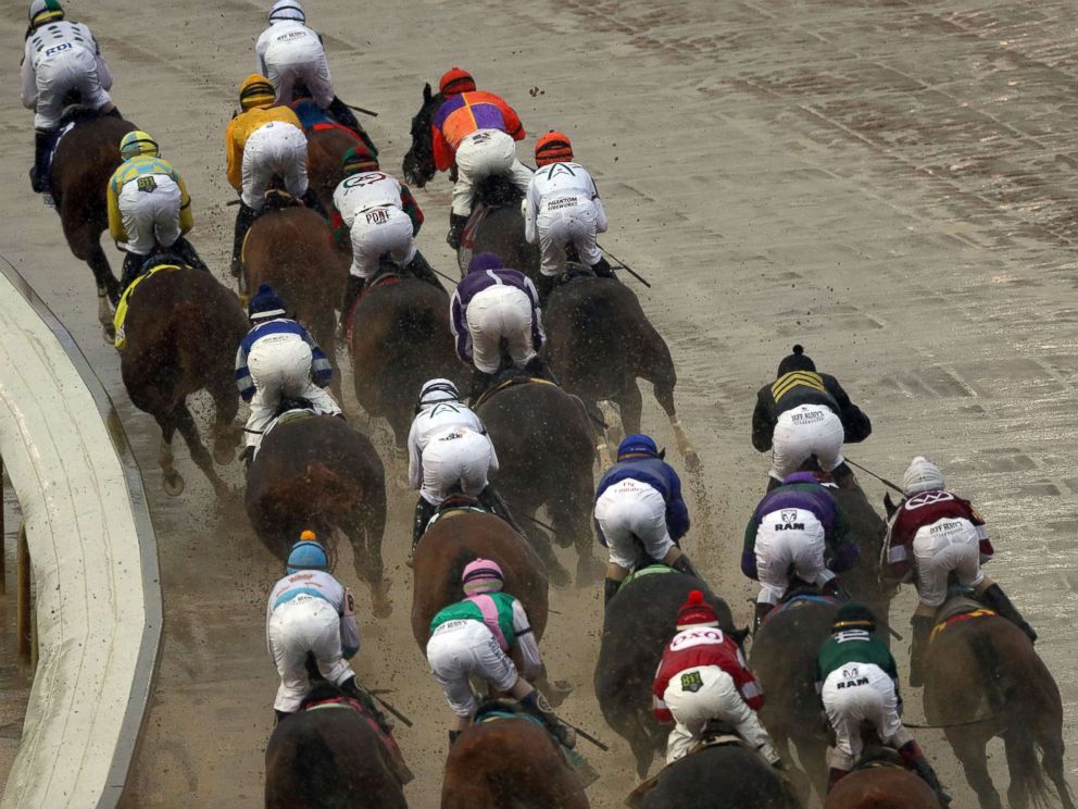 PHOTO: The field of horses rounds the first turn during the 144th Kentucky Derby at Churchill Downs, May 5, 2018 in Louisville, Ky.