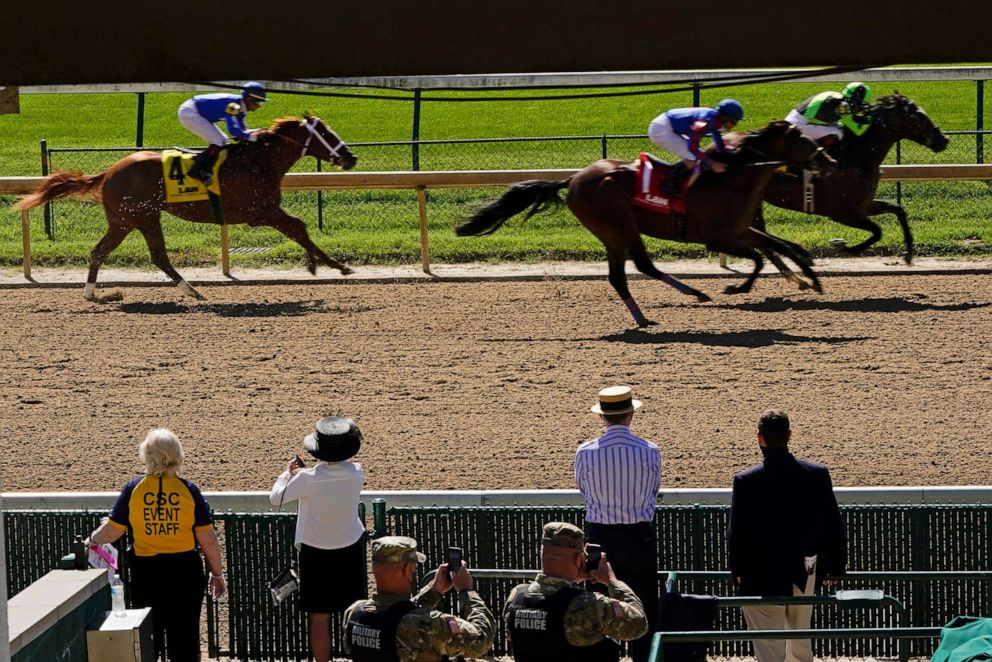 PHOTO: Guest watch a race before the 146th running of the Kentucky Derby at Churchill Downs, Sept. 5, 2020, in Louisville, Ky.