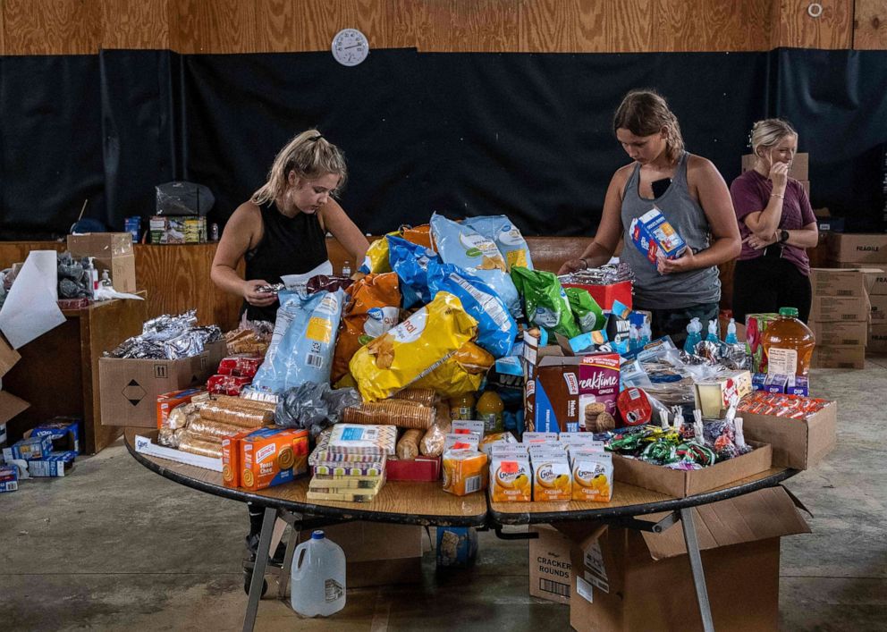 PHOTO: Volunteers work at a distribution center of donated goods in Buckhorn, Ky., following historic flooding in Eastern Kentucky, July 31, 2022.