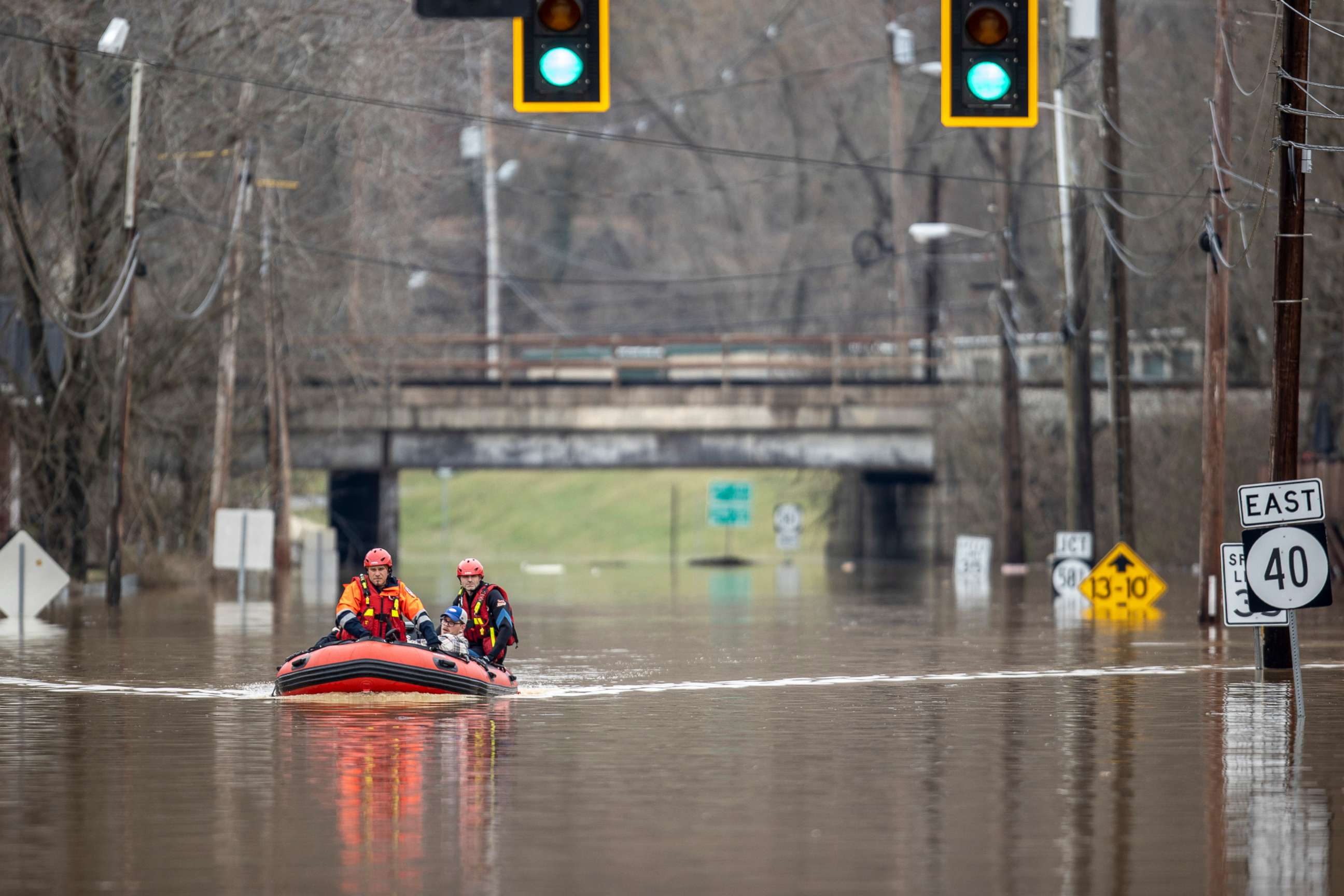 PHOTO: Michael Oiler, left, of the Thelma Fire Department, and Ricky Keeton, of the Oil Springs Fire Department, conduct a water rescue in Paintsville, Ky., following heavy rain on March 1, 2021.
