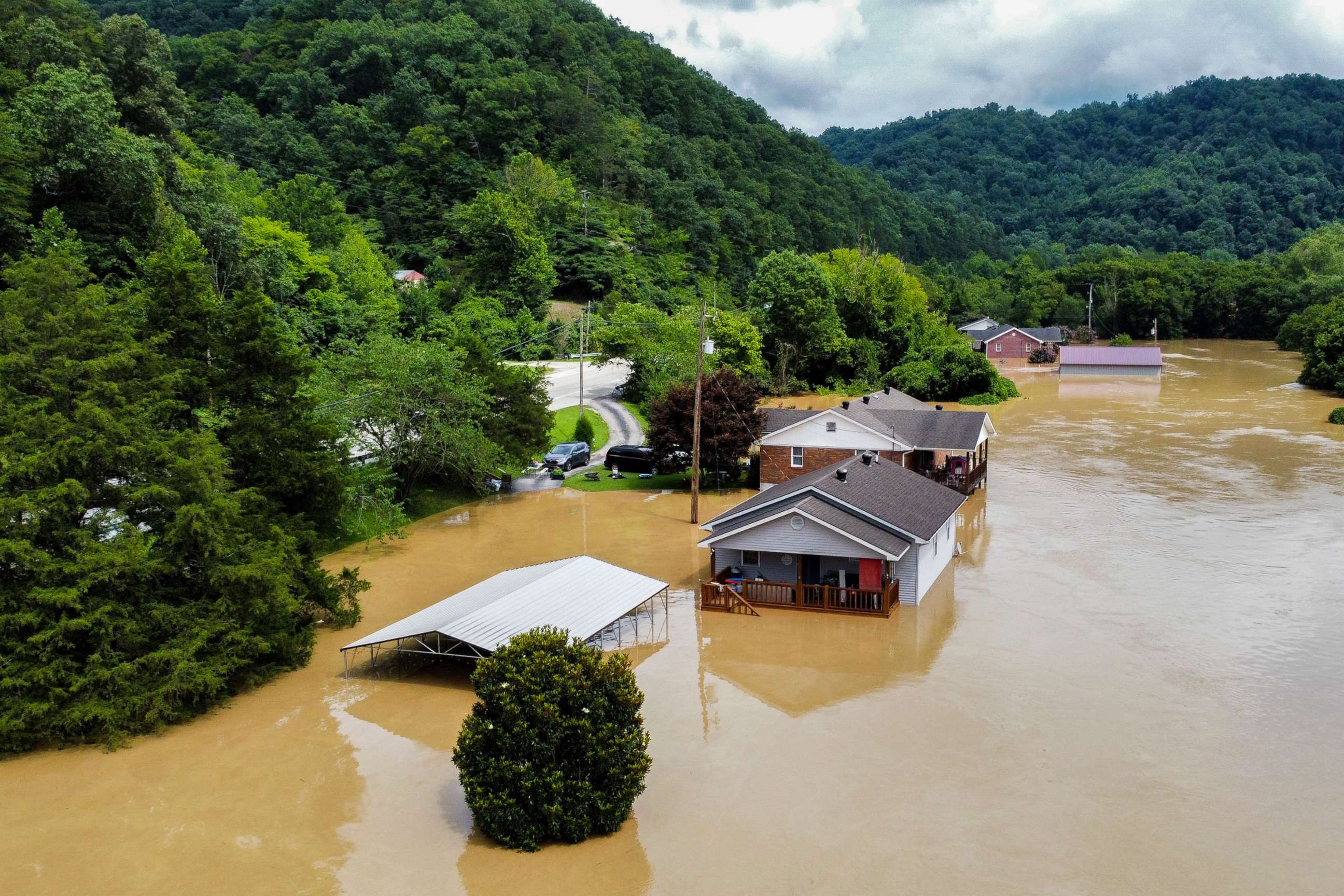 PHOTO: JHomes along Gross Loop off of KY-15 are flooded with water from the North Fork of the Kentucky River in Jackson, Ky., July 28, 2022.