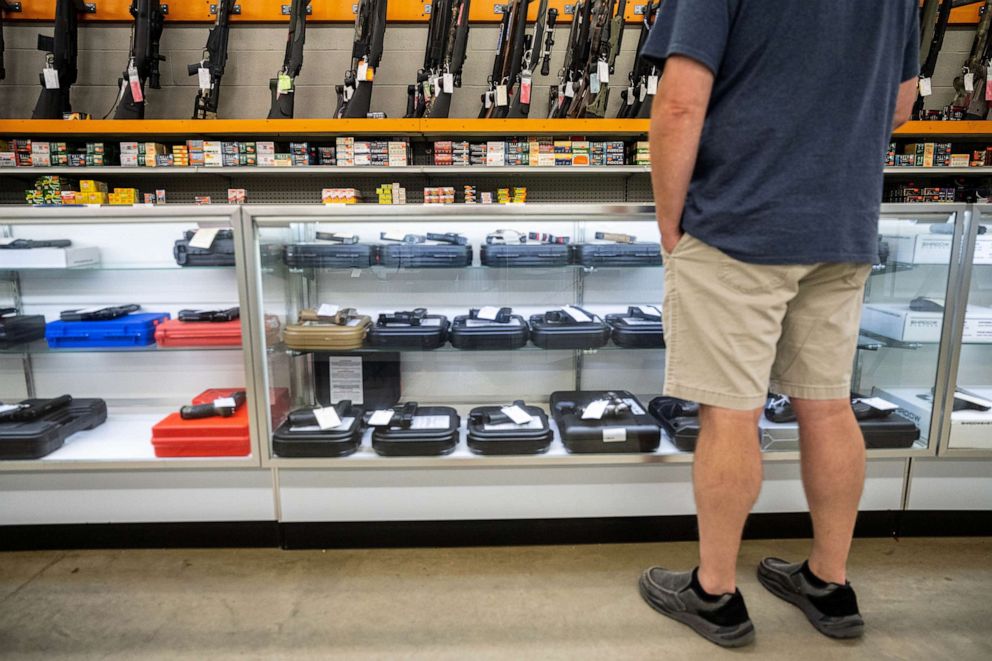 PHOTO: A customer views handguns for sale at Knob Creek Gun Range in West Point, Kentucky, July 22, 2021.