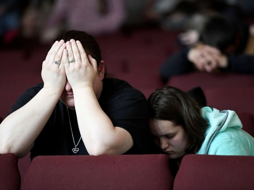 PHOTO: Tiffany Moreland and her daughter Emily Moreland attend a prayer vigil for students killed and injured after a 15-year-old boy opened fire with a handgun at Marshall County High School, Kentucky, Jan. 23, 2018.