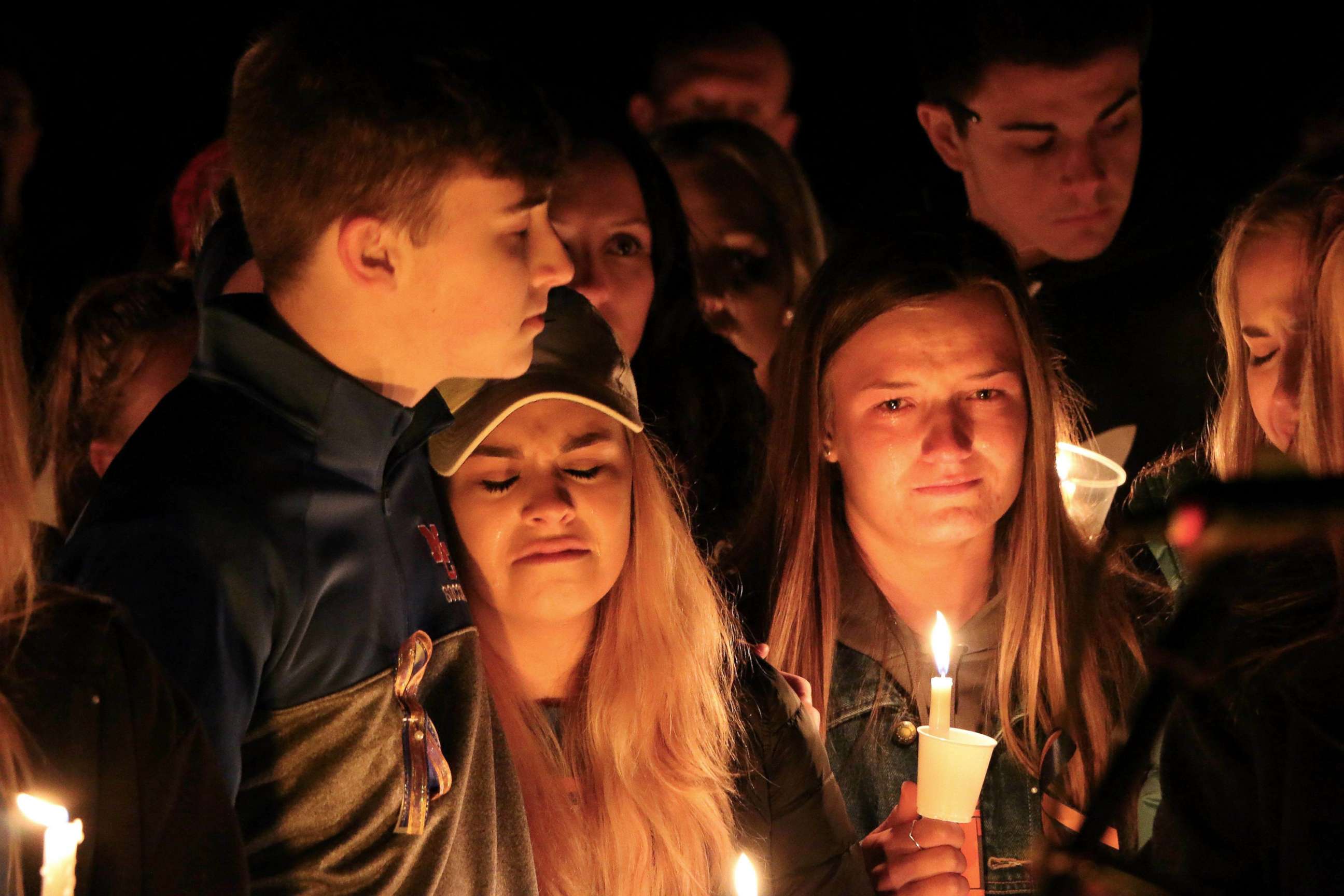 PHOTO: People attend a vigil for the victims of a fatal shooting at Marshall County High School, Jan. 25, 2018, at Mike Miller County Park in Benton, Ky. 