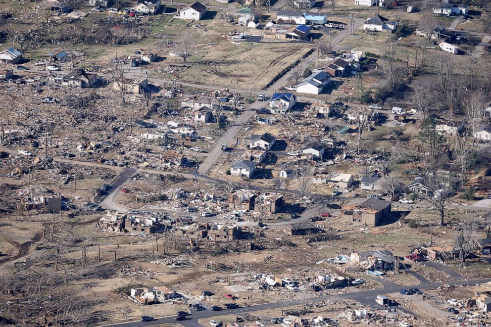 PHOTO: In this aerial view, homes and surrounding area are heavily damaged after they were hit by a tornado three days prior, on December 13, 2021 in Dawson Springs, Kentucky.