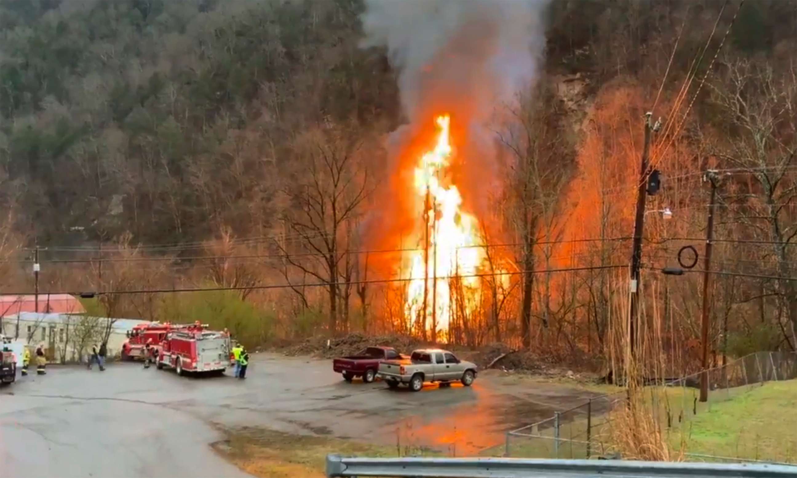 First responders are on the scene of a train derailment in eastern Kentucky, Feb. 13, 2020. Two crew members of the CSX train were trapped and a flammable liquid was leaking into a nearby river, said Charles Maynard with Pike County Emergency Management.