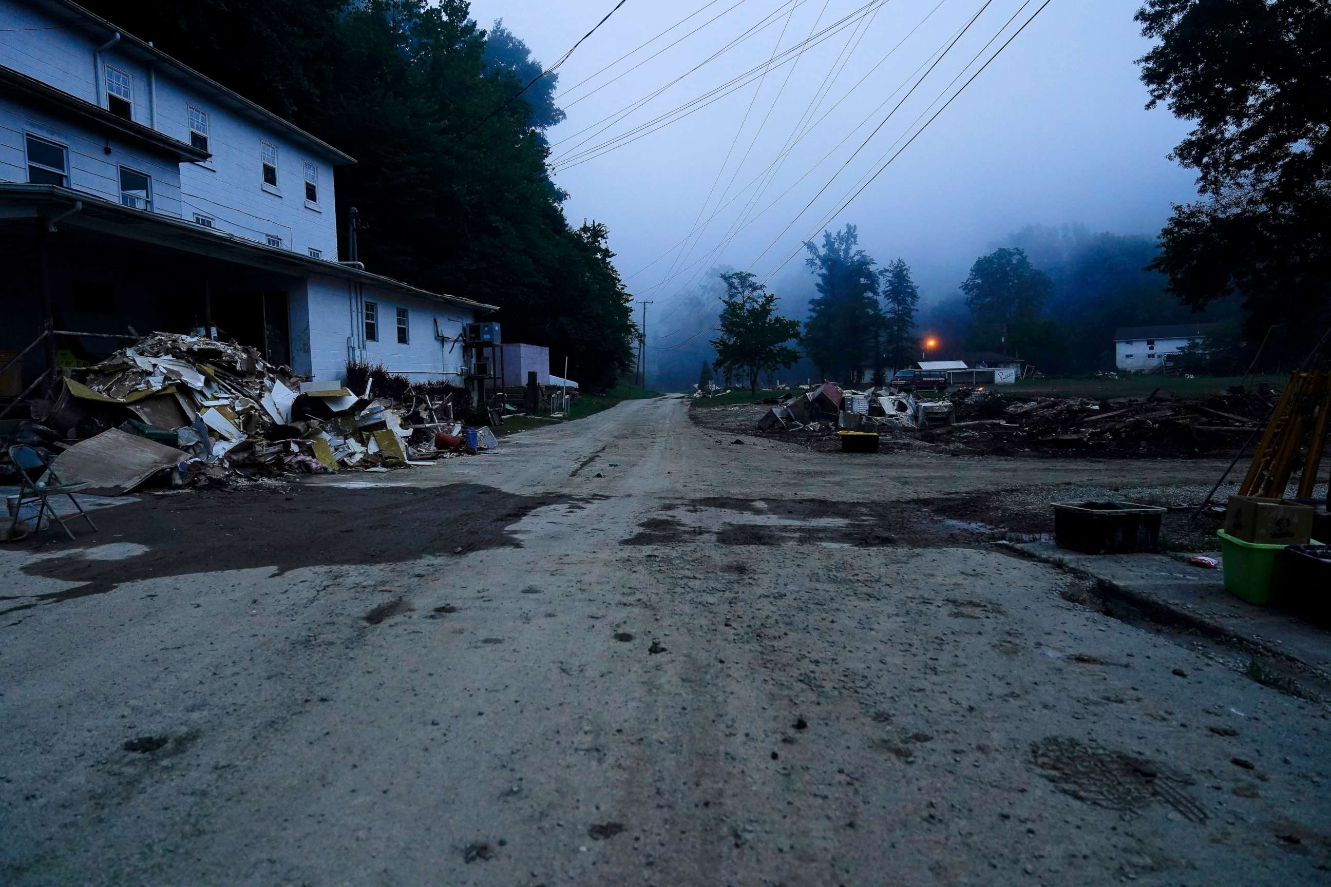 PHOTO: Piles of debris and a mud cover road are seen after massive flooding, Aug. 5, 2022, in Lost Creek, Ky.