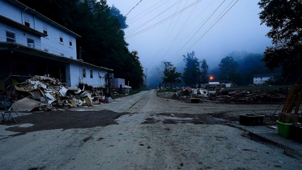 PHOTO: Piles of debris and a mud covered road are seen after massive flooding, Aug. 5, 2022, in Lost Creek, Ky.