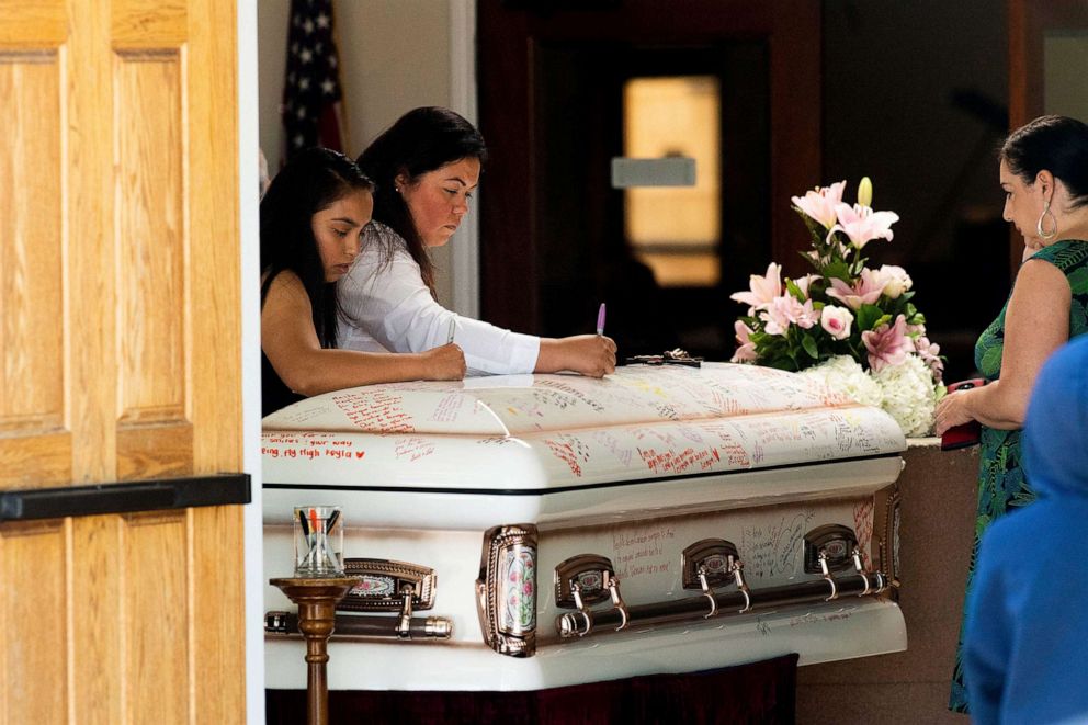 PHOTO: Mourners write on Keyla Salazar's casket during the 13-year-old's funeral on Tuesday, Aug. 6, 2019, in San Jose, Calif.