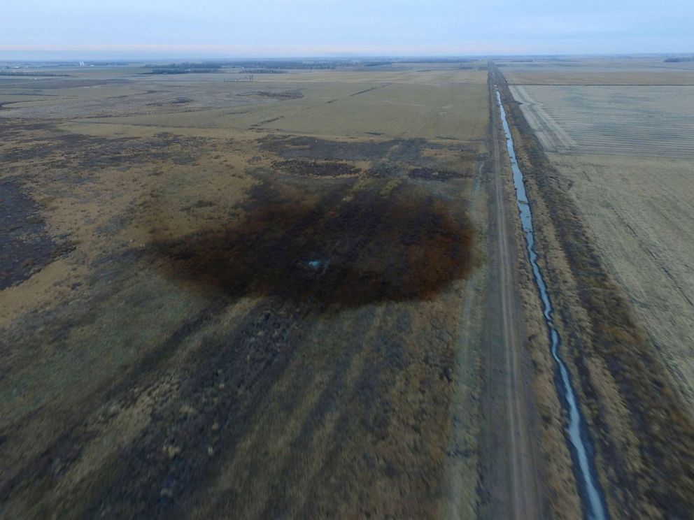 PHOTO: FILE - An aerial view shows the darkened ground of an oil spill which shut down the Keystone pipeline between Canada and the United States, located in an agricultural area near Amherst, South Dakota.