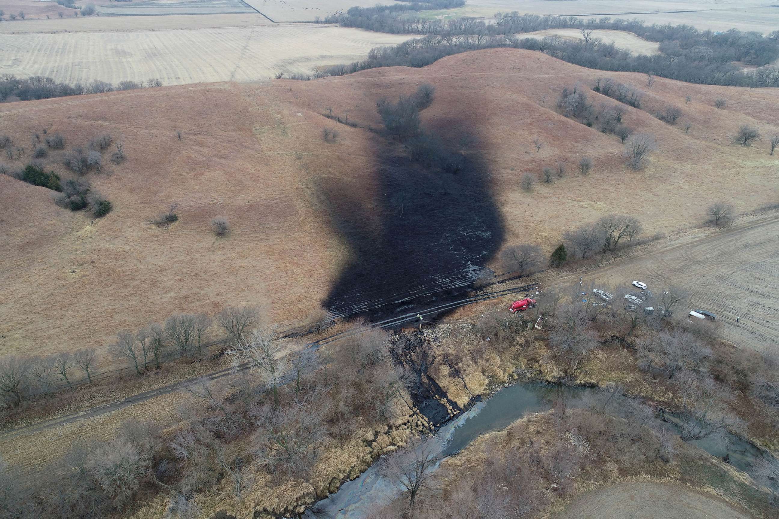 PHOTO: Emergency crews work to clean up the largest U.S. crude oil spill in nearly a decade, following the leak at the Keystone pipeline operated by TC Energy in rural Washington County, Kansas, Dec. 9, 2022.