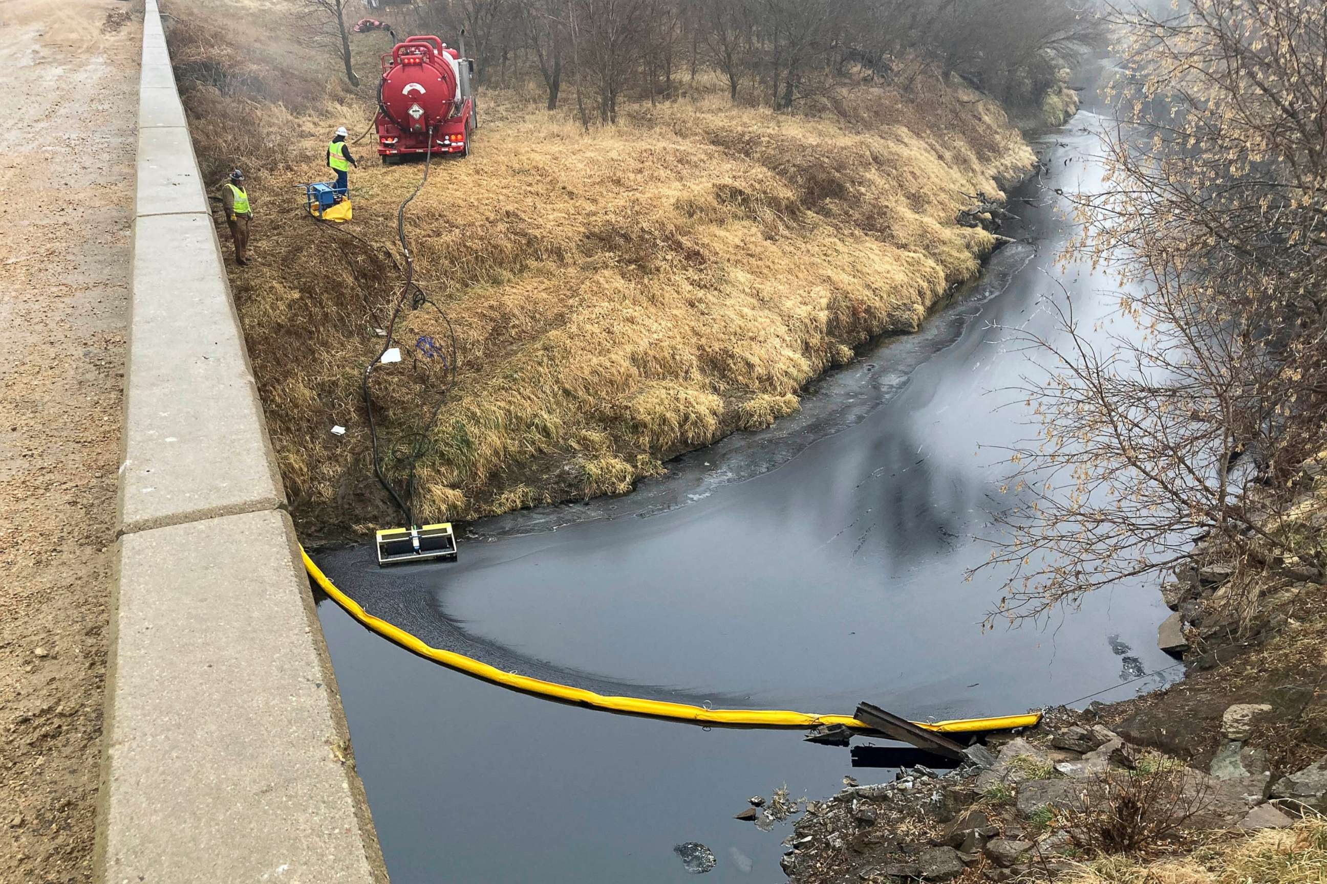 PHOTO: A remediation company deploys a boom on the surface of an oil spill after a Keystone pipeline ruptured at Mill Creek in Washington County, Kansas, Dec. 8, 2022.