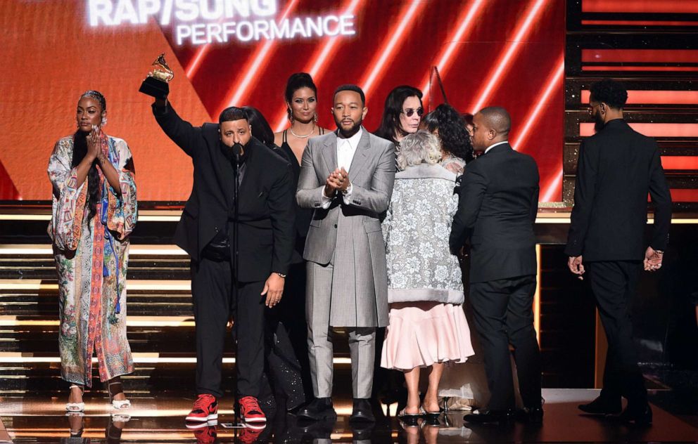 PHOTO: Samantha Smith, DJ Khaled, and John Legend accept the Best Rap/Sung Performance award for 'Higher' onstage during the 62nd Annual GRAMMY Awards at STAPLES Center on Jan. 26, 2020 in Los Angeles.