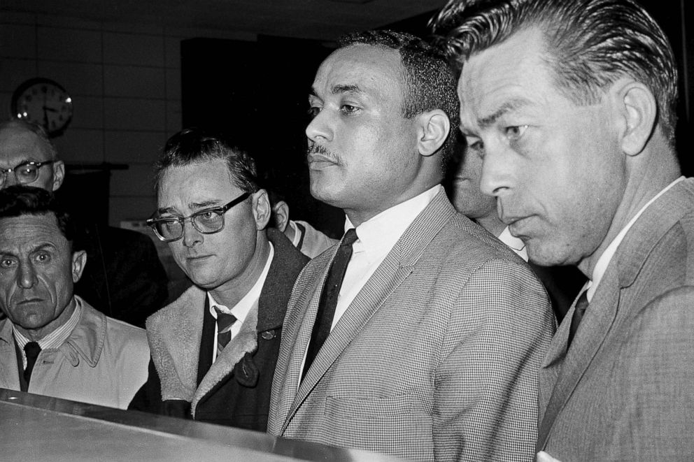 PHOTO: Khalil Islam, center, is booked as a suspect in the slaying of Malcolm X, in New York, March 3, 1965.