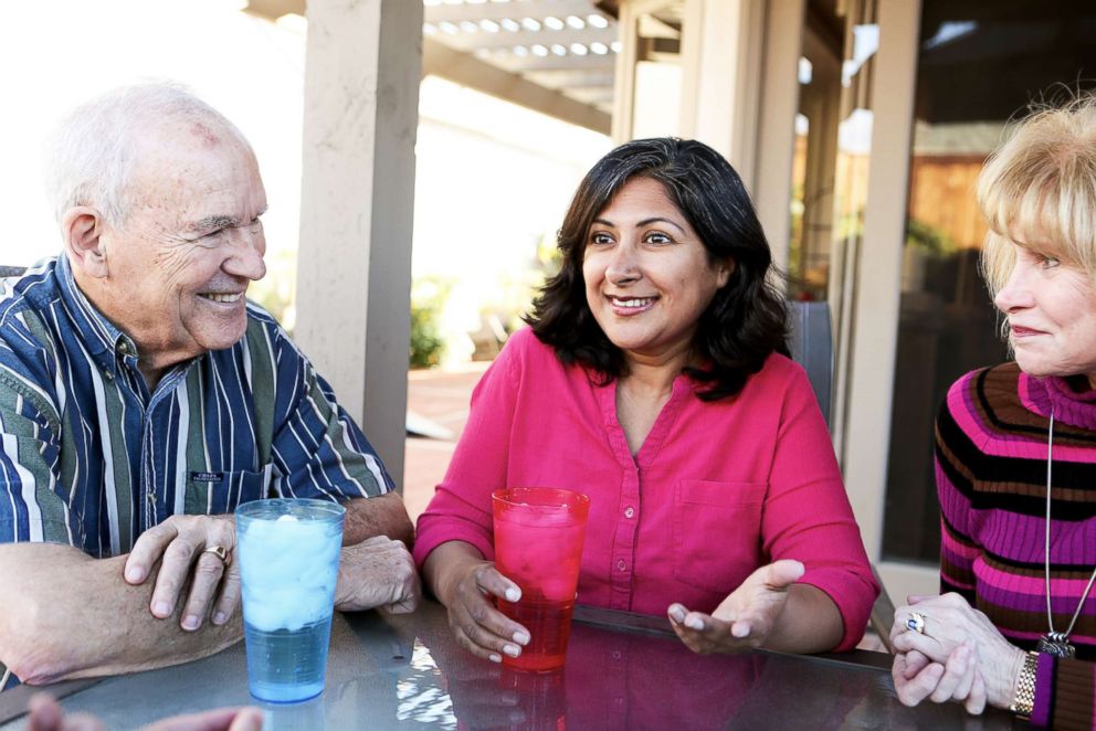 PHOTO: Farrah Khan speaks to two supporters. Hailing from Pakistan, Farrah Khan references the importance of minority groups running for office.