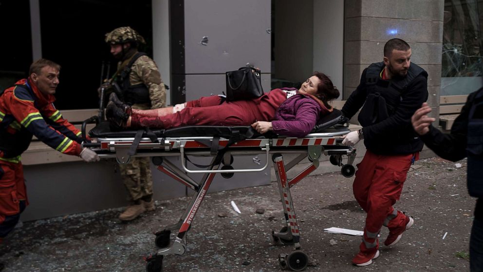 PHOTO: A woman is taken to an ambulance after being injured in a Russian bombardment in Kharkiv, Ukraine, April 17, 2022.