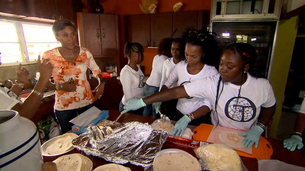 PHOTO: Tesroy and Maekiaphan Phillips and their 12 children have cooked and distributed more than 3,500 meals to people in St. Thomas.