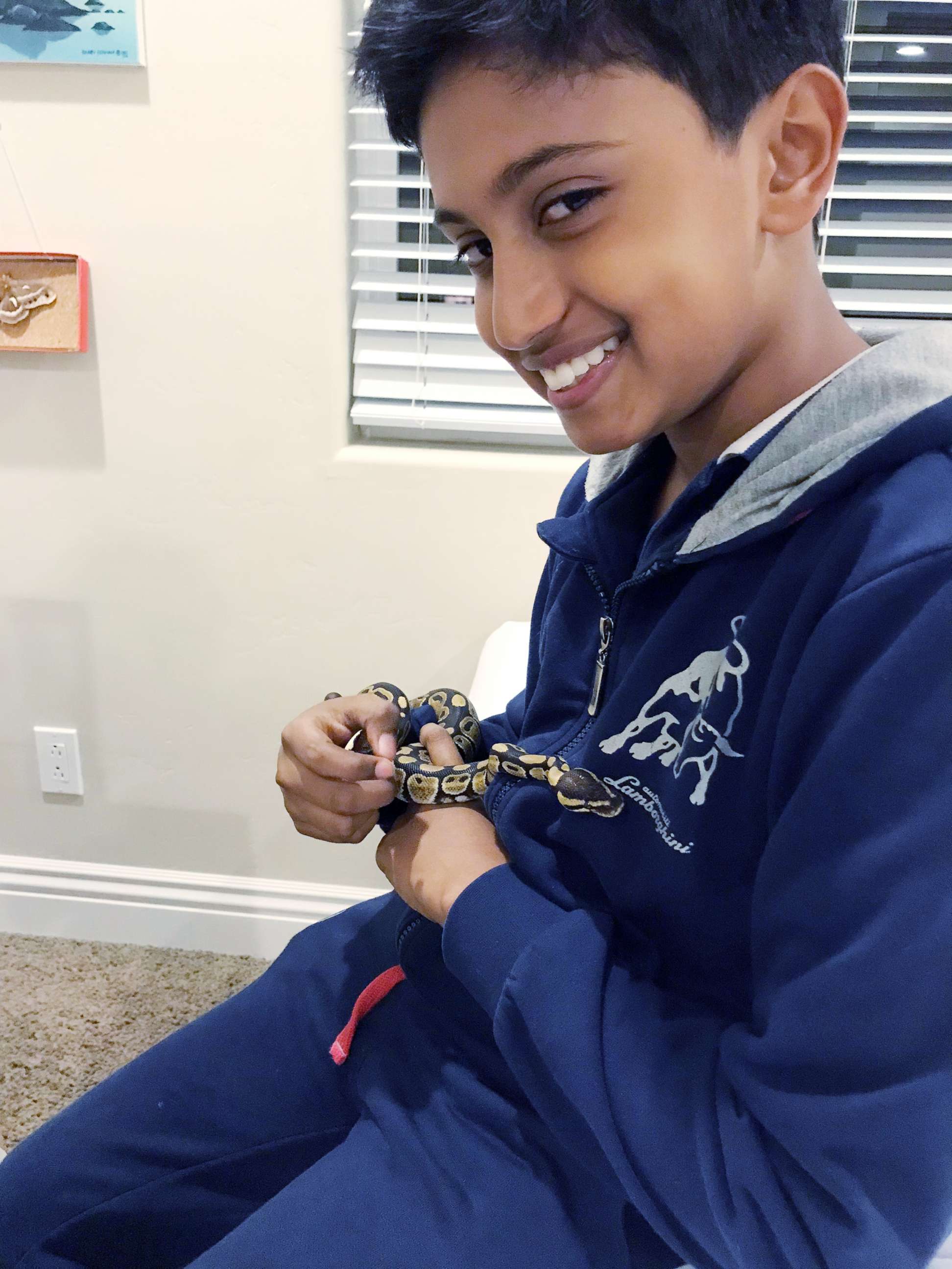 PHOTO: According to his family, Kieran Shafritz de Zoysa, an American fifth grader pictured here with a pet snake, was killed in a series of bombings in Sri Lanka on April 21, 2019, that killed at least 290 people.