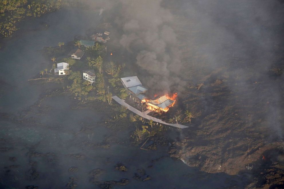 PHOTO: Lava destroys homes in the Kapoho area, east of Pahoa, during ongoing eruptions of the Kilauea Volcano in Hawaii, June 5, 2018.