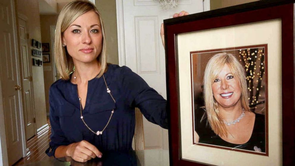 PHOTO: In this May 25, 2016, photo, Kim Pack poses with a photo of her late mother, talk-show host April Kauffman, in Linwood, N.J.