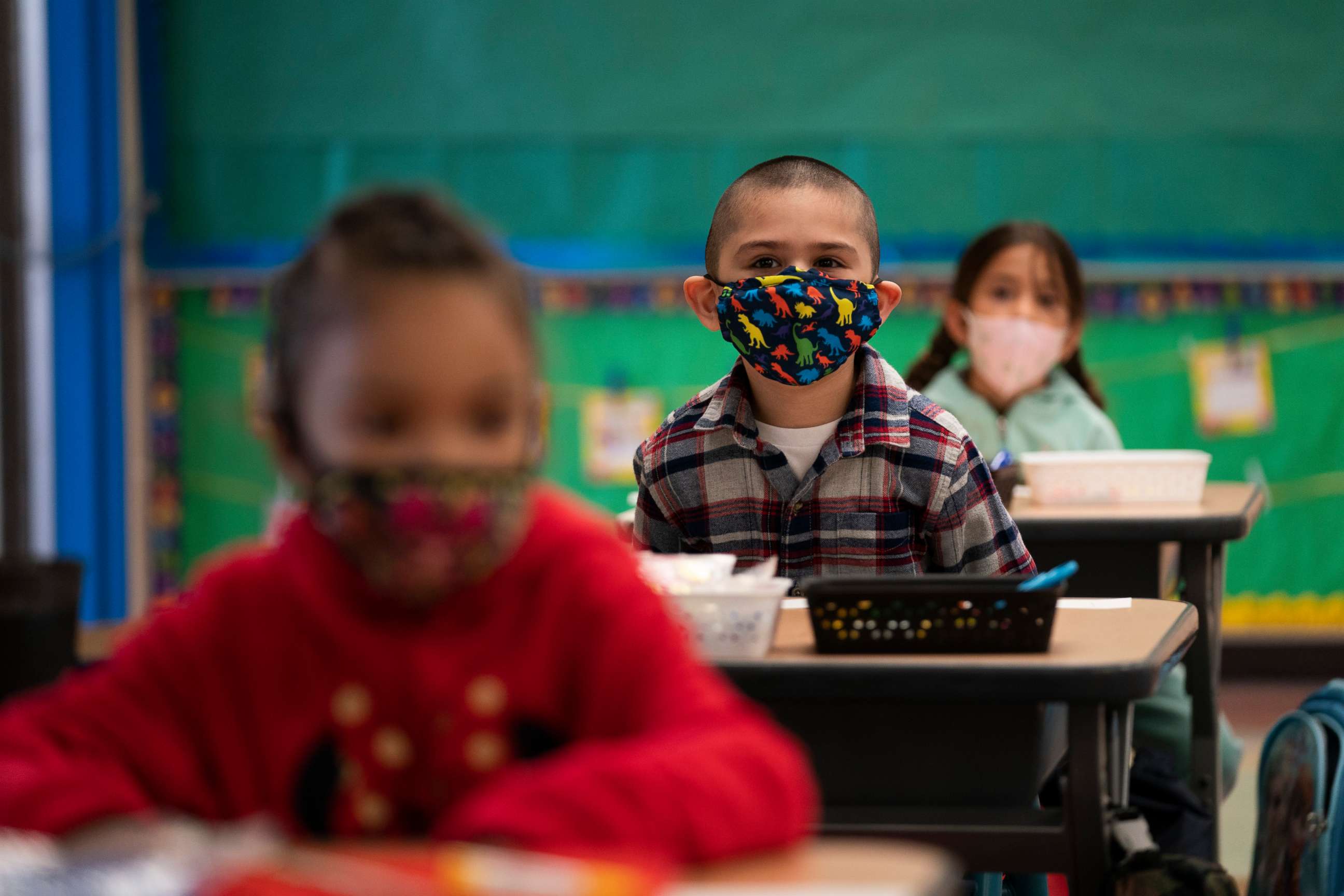 PHOTO: Kindergarten students wearing face masks sit in their classroom on the first day of in-person learning at Maurice Sendak Elementary School in Los Angeles, California, on April 13, 2021, amid the coronavirus pandemic.