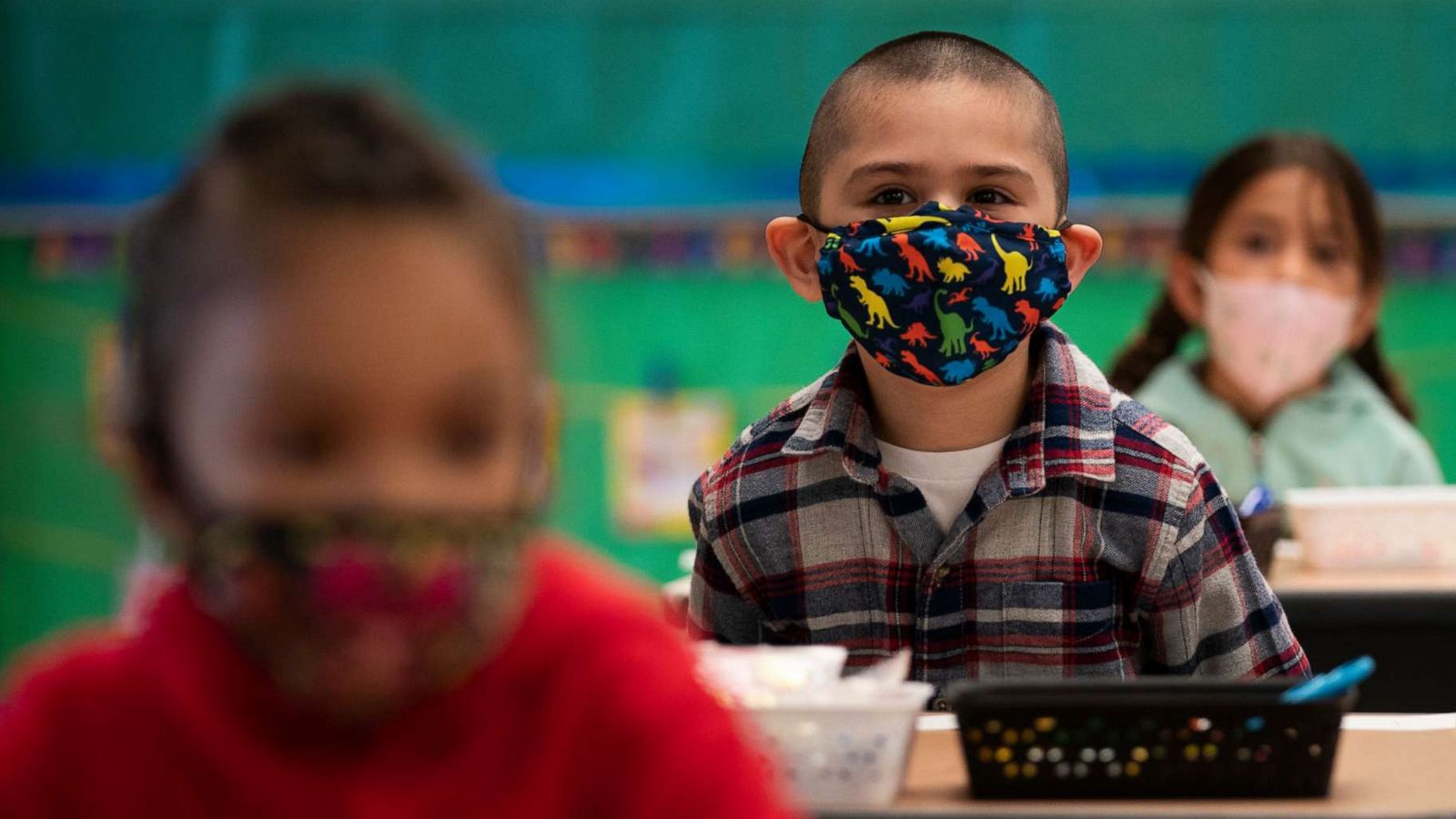 PHOTO: Kindergarten students wearing face masks sit in their classroom on the first day of in-person learning at Maurice Sendak Elementary School in Los Angeles, California, on April 13, 2021, amid the coronavirus pandemic.