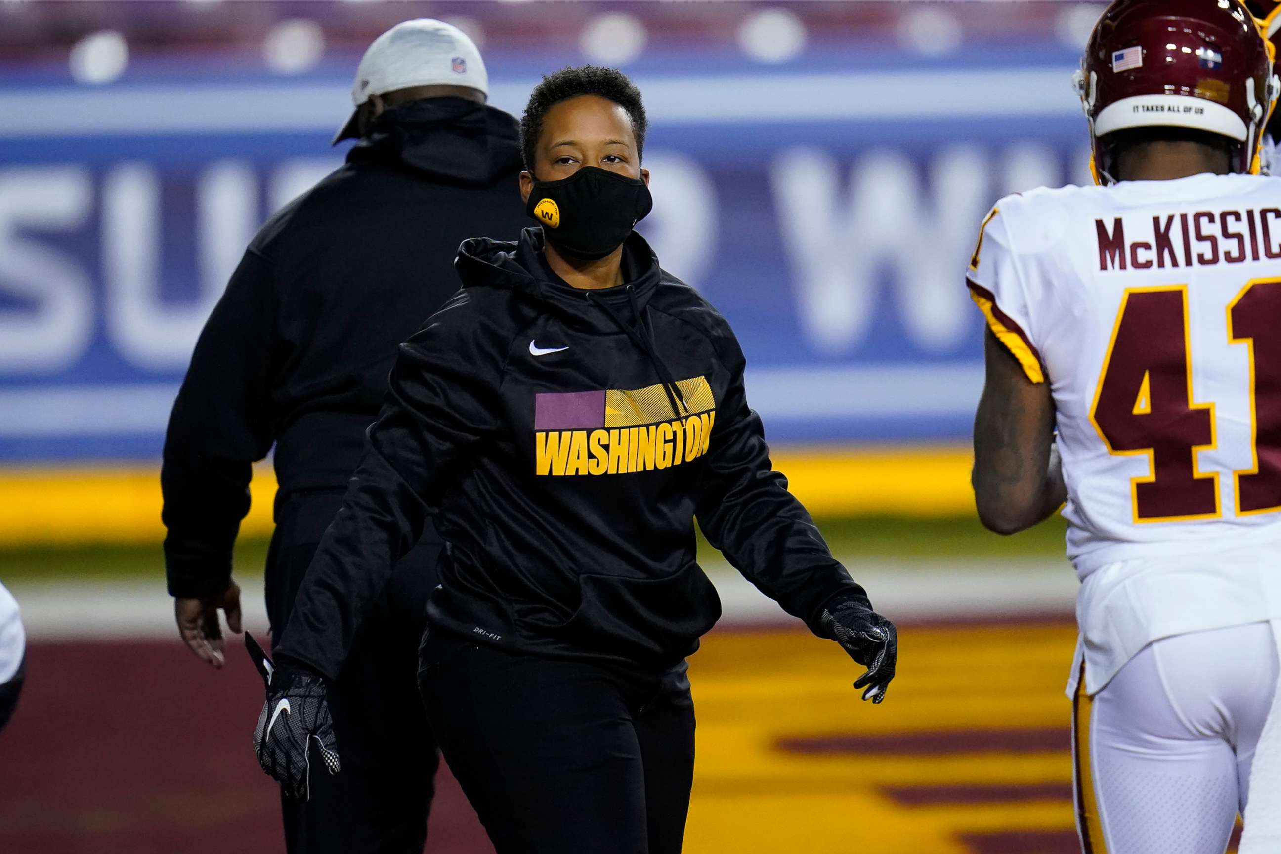 PHOTO: Washington Football Team full-year coaching intern Jennifer King on the field before the start of an NFL wild-card playoff football game against the Tampa Bay Buccaneers, Jan. 9, 2021, in Landover, Md.