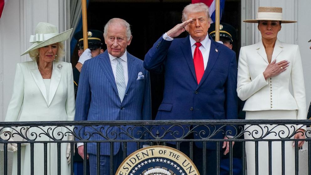 PHOTO: President Donald Trump salutes as he, first lady Melania Trump, Britain's King Charles and Queen Camilla watch a pass in review during an arrival ceremony on the South Lawn of the White House in Washington, April 28, 2026.