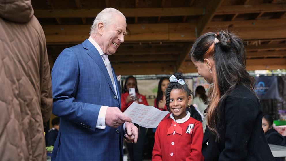 PHOTO: Britain's King Charles III receives a letter from a young attendee during an event at Harlem Grown, April 29, 2026 in New York City. 