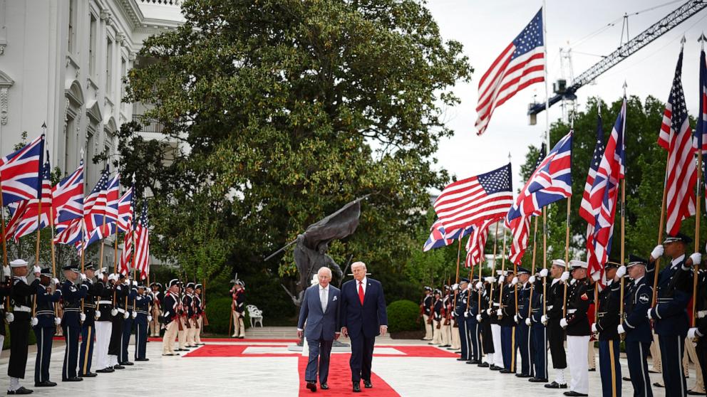 PHOTO: President Donald Trump and Britain's King Charles III walk through the Rose Garden to the Oval Office of the White House in Washington, April 28, 2026. 