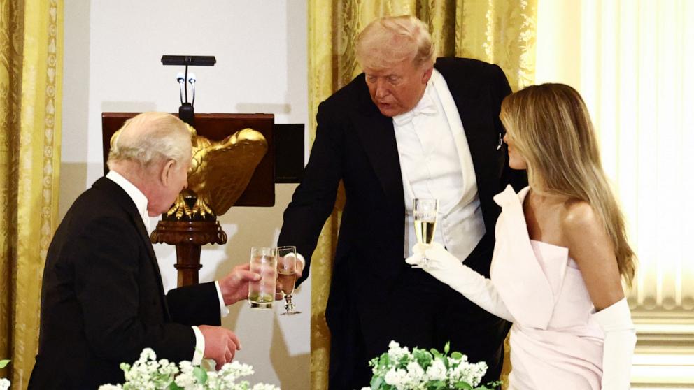 PHOTO: President Donald Trump, First Lady Melania Trump and Britain's King Charles III raise a toast as they attend a State Dinner in the East Room of the White House in Washington, April 28, 2026.