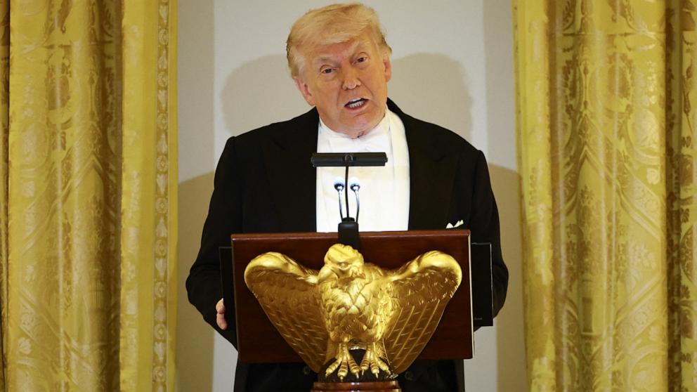 PHOTO: President Donald Trump speaks as he and First Lady Melania Trump host Britain's King Charles III and Queen Camilla during a State Dinner in the East Room of the White House in Washington, April 28, 2026.