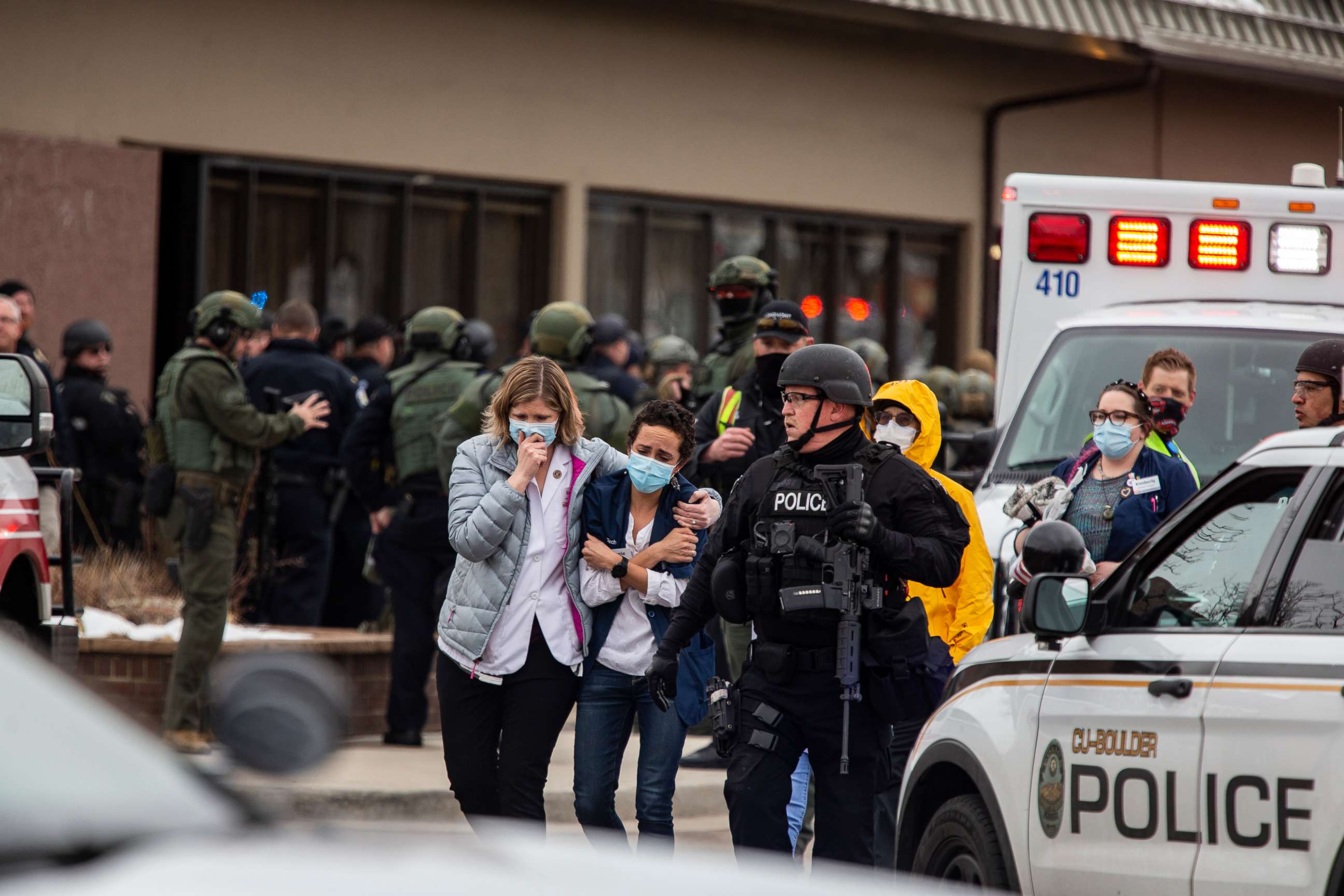 PHOTO: People walk out of a King Sooper's Grocery store after a gunman opened fire on March 22, 2021, in Boulder, Colo.