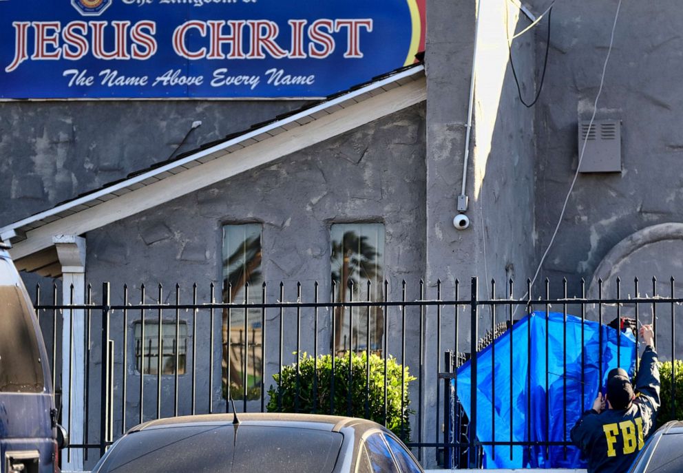 PHOTO: FBI agents cover a fence on the grounds of the Kingdom of Jesus Christ Church in the Van Nuys section of Los Angeles, Jan. 29, 2020.