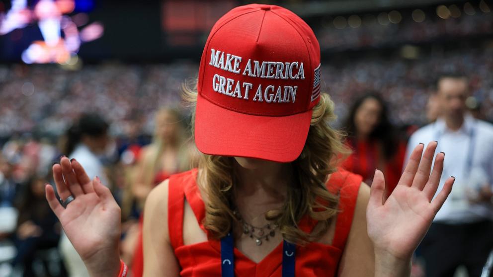PHOTO: An attendee prays at the memorial service for political activist Charlie Kirk, September 21, 2025 in Glendale, Arizona.