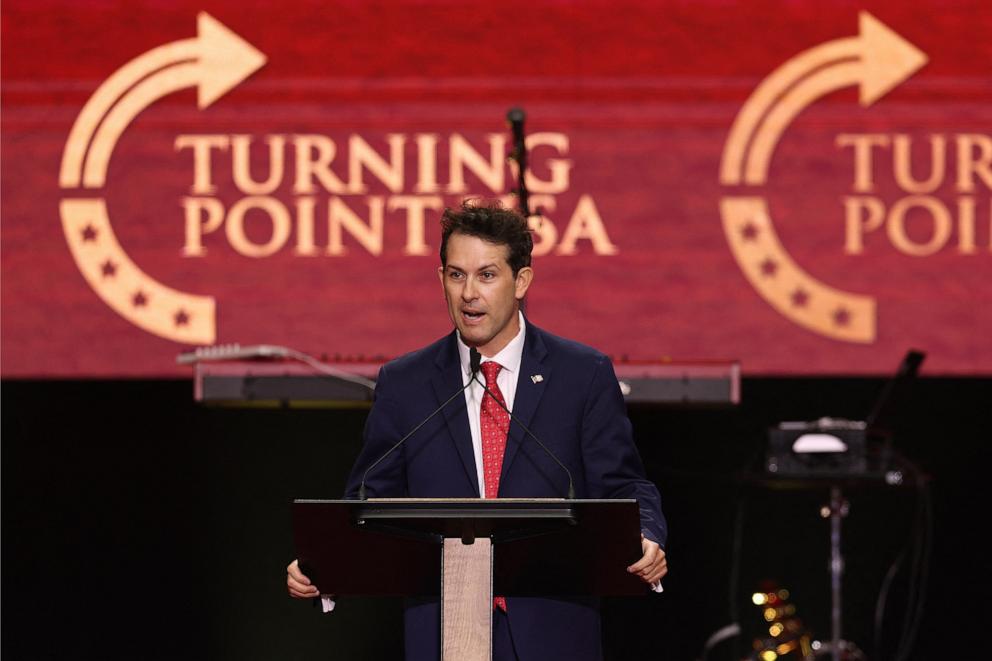 PHOTO: Turning Point USA COO Tyler Bowyer former chief of staff to right-wing activist Charlie Kirk, speaks during the public memorial service for right-wing activist in Glendale, Arizona, September 21, 2025.