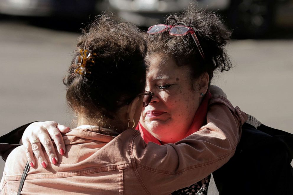 PHOTO: Carmen Gray, left, hugs her sister, Bridget Parkhill, after discussing concerns about coughing exhibited by their mother in Kirkland, Wash., March 4, 2020.