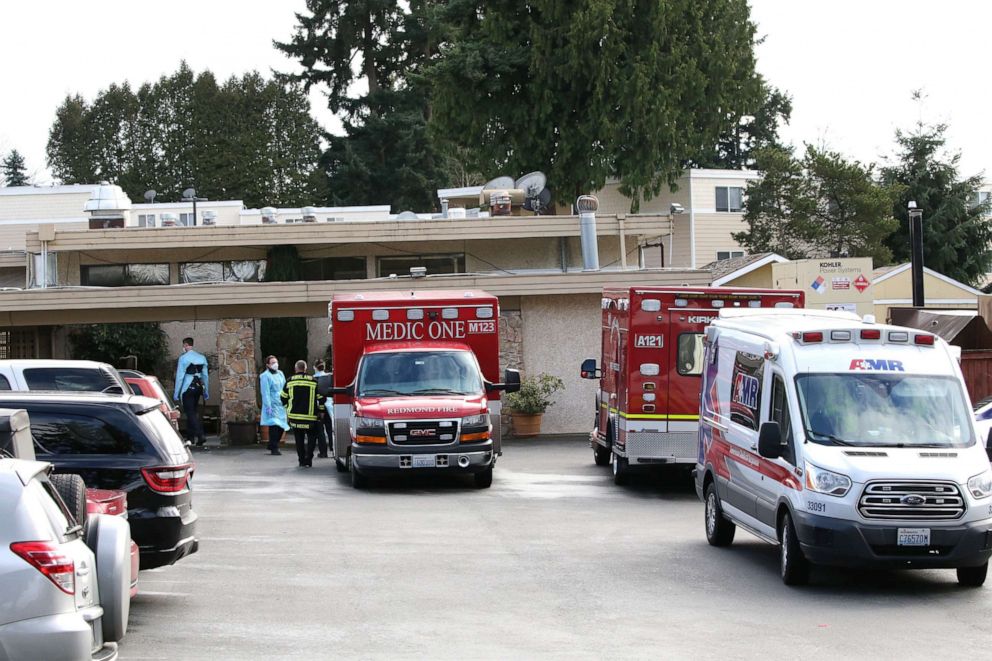 PHOTO: Several ambulances arrive at the Life Care Center where several residents have died from COVID-19 and six others have tested positive in Kirkland, Wash., March 7, 2020.