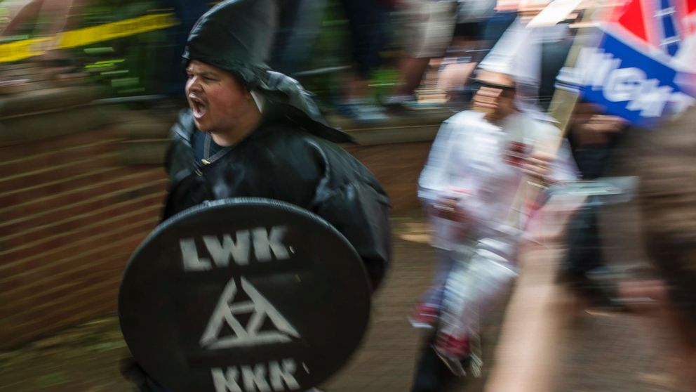 PHOTO: Members of the Ku Klux Klan arrive for a rally calling for the protection of Southern Confederate monuments, in Charlottesville, Va., July 8, 2017.