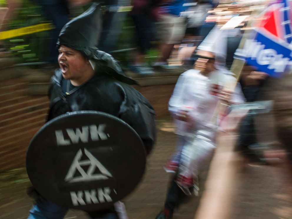 PHOTO: Members of the Ku Klux Klan arrive for a rally calling for the protection of Southern Confederate monuments, in Charlottesville, Va., July 8, 2017.