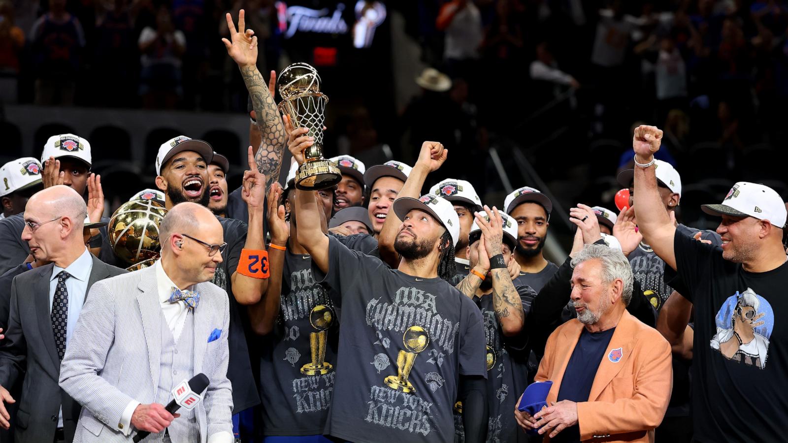 PHOTO: Jalen Brunson of the New York Knicks lifts the Bill Russell NBA Finals Most Valuable Player Award trophy after defeating the San Antonio Spurs in Game Five of the 2026 NBA Finals, June 13, 2026 in San Antonio.