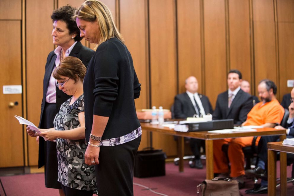 PHOTO: Michelle Knight addresses the court while Ariel Castro listens in the background on August 1, 2013 in Cleveland, Ohio. Castro was in court awaiting his sentence for abducting three women, including Knight, from 2002 and 2004.
