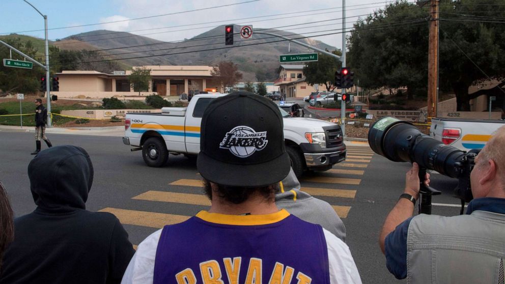 PHOTO: People gather near the scene of a helicopter crash in Calabasas on Sunday, Jan. 26, 2020, that killed nine people, including former Los Angeles Lakers star Kobe Bryant and his daughter, Gianna Maria.