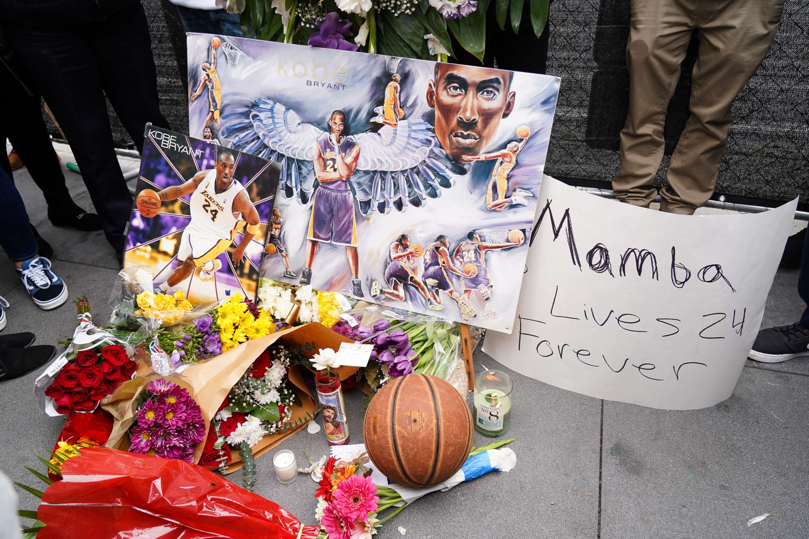PHOTO: Flowers and tributes are left at a makeshift memorial for former NBA player Kobe Bryant outside the 62nd Annual GRAMMY Awards at STAPLES Center on Jan. 26, 2020, in Los Angeles. Bryant, 41, died today in a helicopter crash in near Calabasas, Calif.