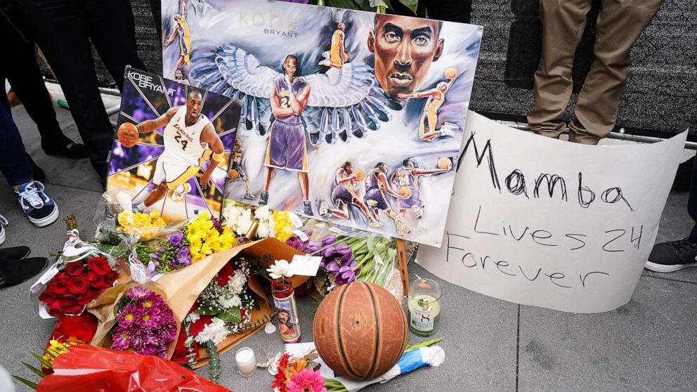 PHOTO: Flowers and tributes are left at a makeshift memorial for former NBA player Kobe Bryant outside the 62nd Annual GRAMMY Awards at STAPLES Center on Jan. 26, 2020, in Los Angeles. Bryant, 41, died today in a helicopter crash in near Calabasas, Calif.