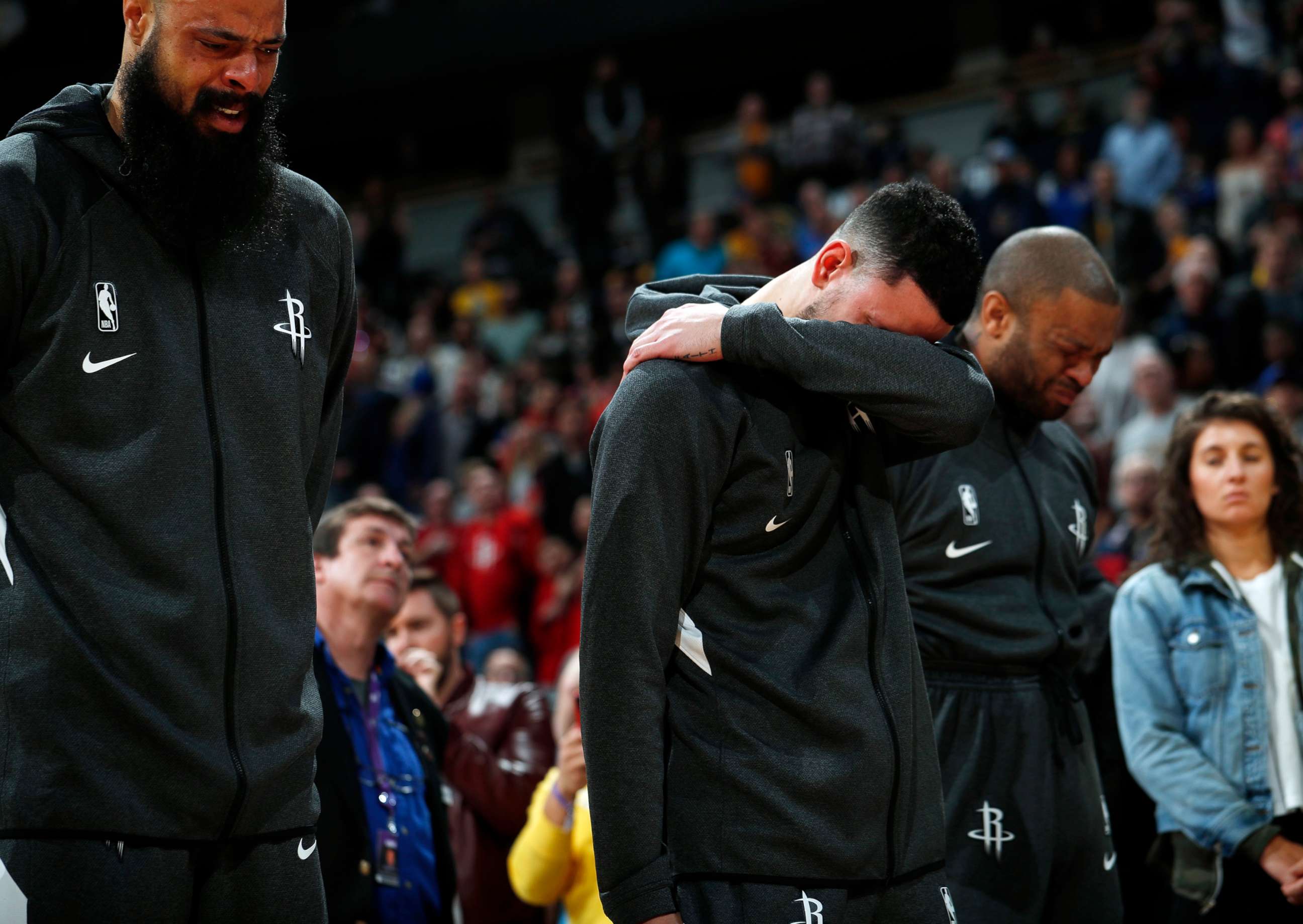PHOTO: From left to right, Houston Rockets center Tyson Chandler, guard Austin Rivers and forward P.J. Tucker react during a tribute to Kobe Bryant before an NBA basketball game against the Denver Nuggets, Jan. 26, 2020, in Denver. 