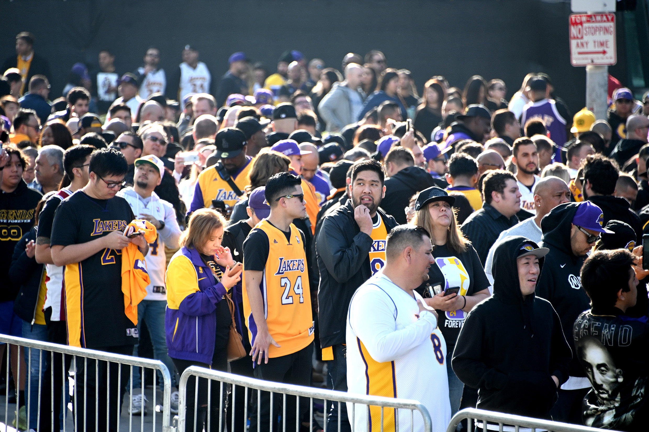 PHOTO: Fans line up outside to Staples Center waiting to enter to attend the memorial to celebrate the life of Kobe Bryant and daughter Gianna Bryant, Los Angeles, Feb. 24, 2020.