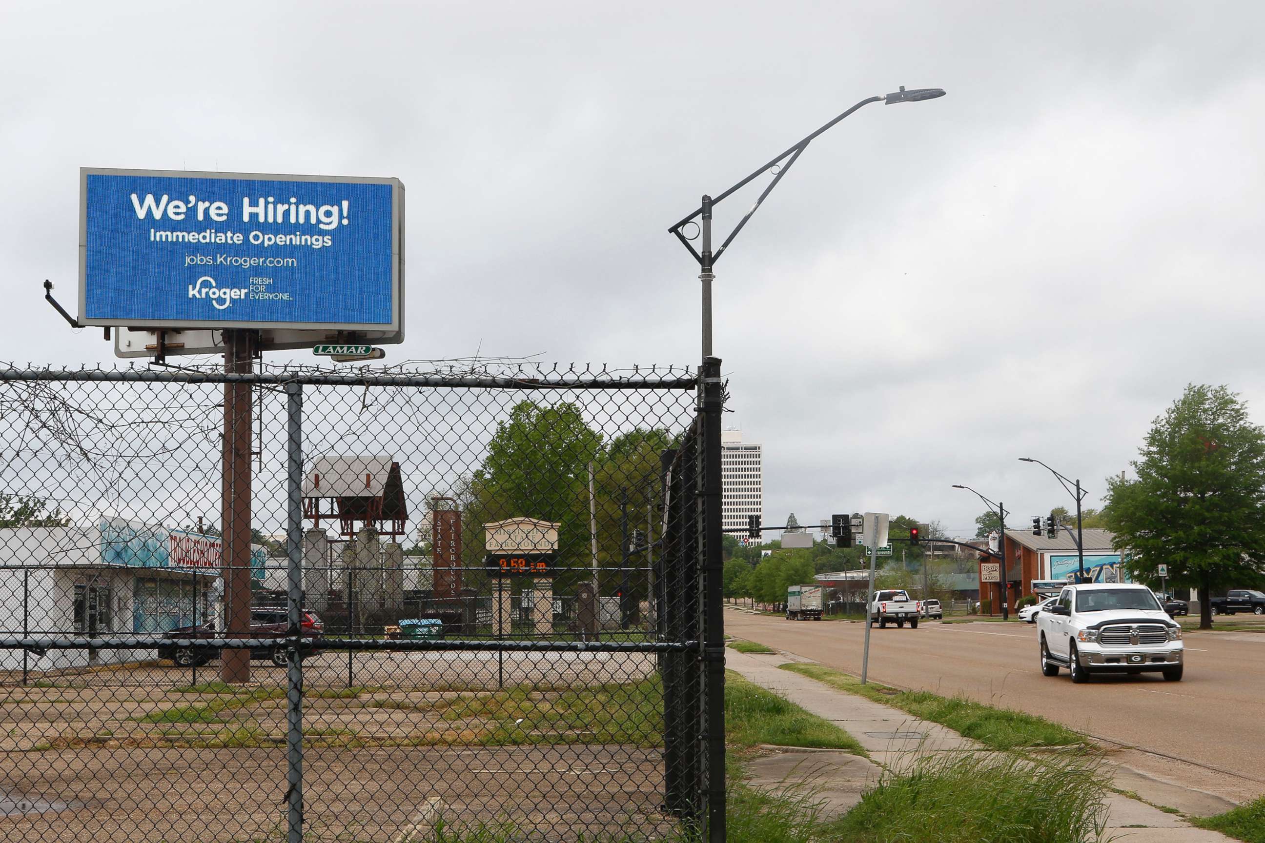 PHOTO: A sign announces that Kroger Company is hiring, March 23, 2020, in Jackson, Miss.